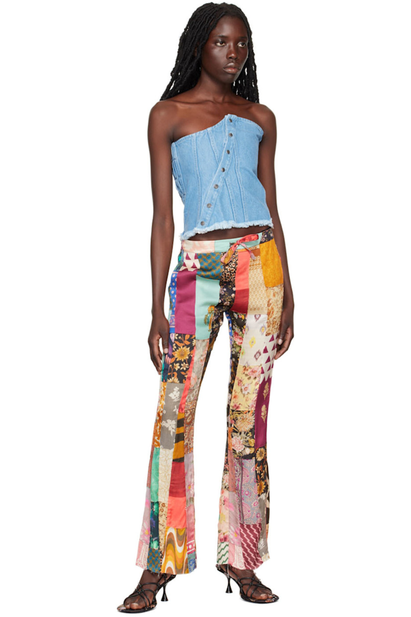 Paneled non-stretch REFIBRA™ cotton and recycled cotton-blend corset.

· Strapless construction 
· Straight neck 
· Offset press-stud closure
· Elasticized shirring at back 
· Frayed edge at hem 
· Unlined 

Supplier color: Blue
