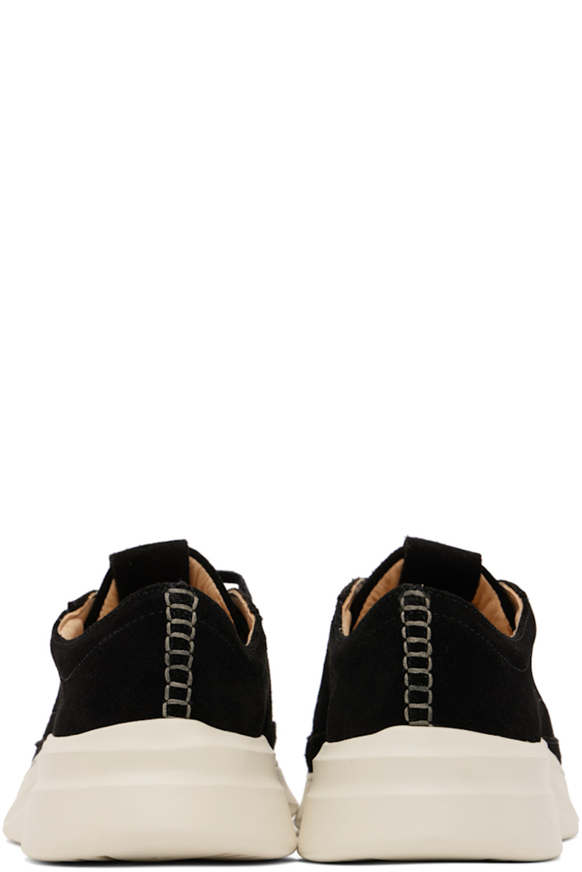 Low-top suede sneakers in black.

· Lace-up closure
· Logo embossed at padded tongue
· Padded collar
· Grained calfskin lining
· Treaded EVA foam rubber sole

Supplier color: Coal