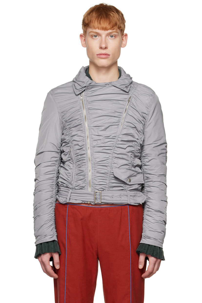 Insulated polyester taffeta jacket. Ruching throughout.

· Spread collar
· Offset zip closure
· Zip pockets and flap pocket
· Belt loops and detachable cinch belt at hem
· Zip vent at cuffs
· Full satin lining

Available exclusively at SSENSE.

Supplier color: Gray