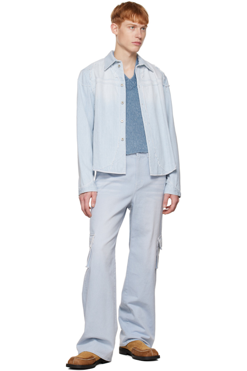 Non-stretch denim jacket. Distressing, exposed seams, and frayed trim throughout.

· Spread collar 
· Button closure
· Shirttail hem
· Unlined

Available exclusively at SSENSE.

Supplier color: Blue