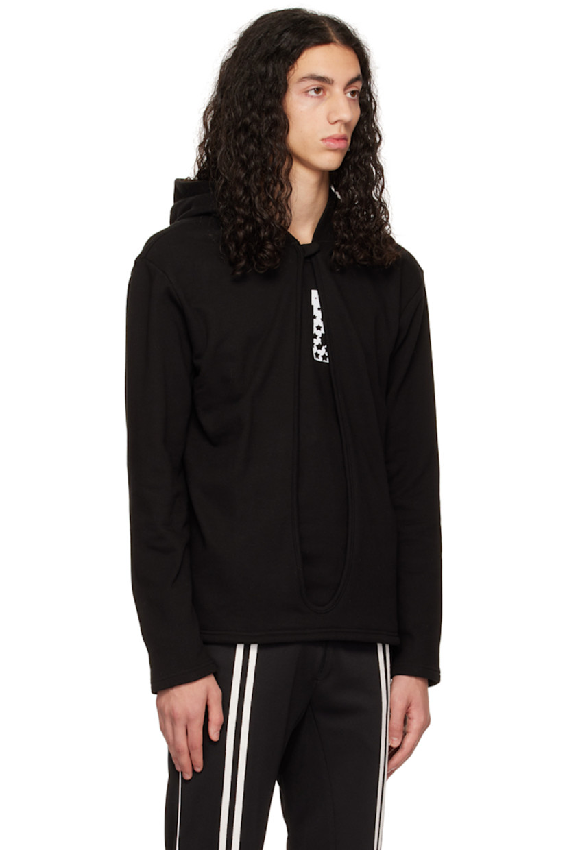 French terry hoodie.

· Layered construction
· Press-stud fastening at hood
· Cutout at front
· Graphic text printed at front

Available exclusively at SSENSE.

Supplier color: Black
