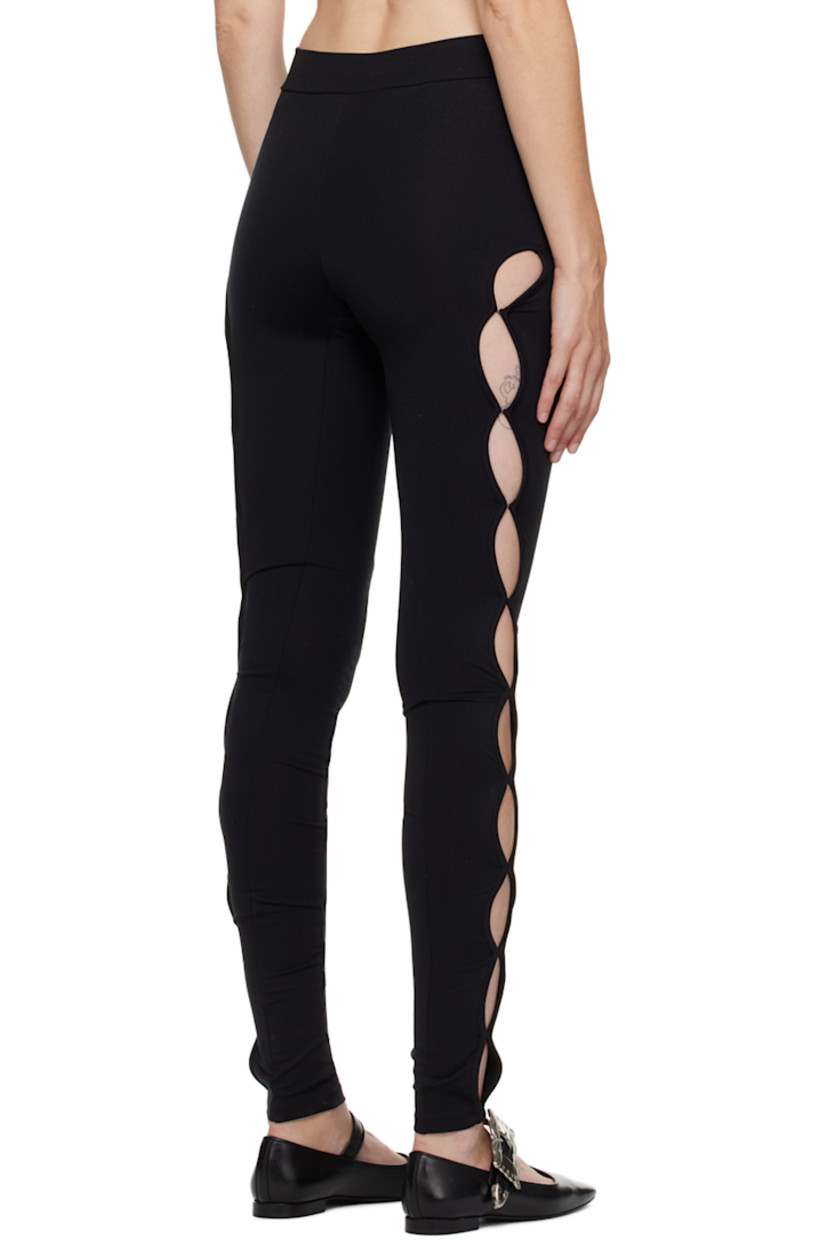 Stretch polyester jersey leggings. Vented side seams with hook-eye fastenings.

Supplier color: Black