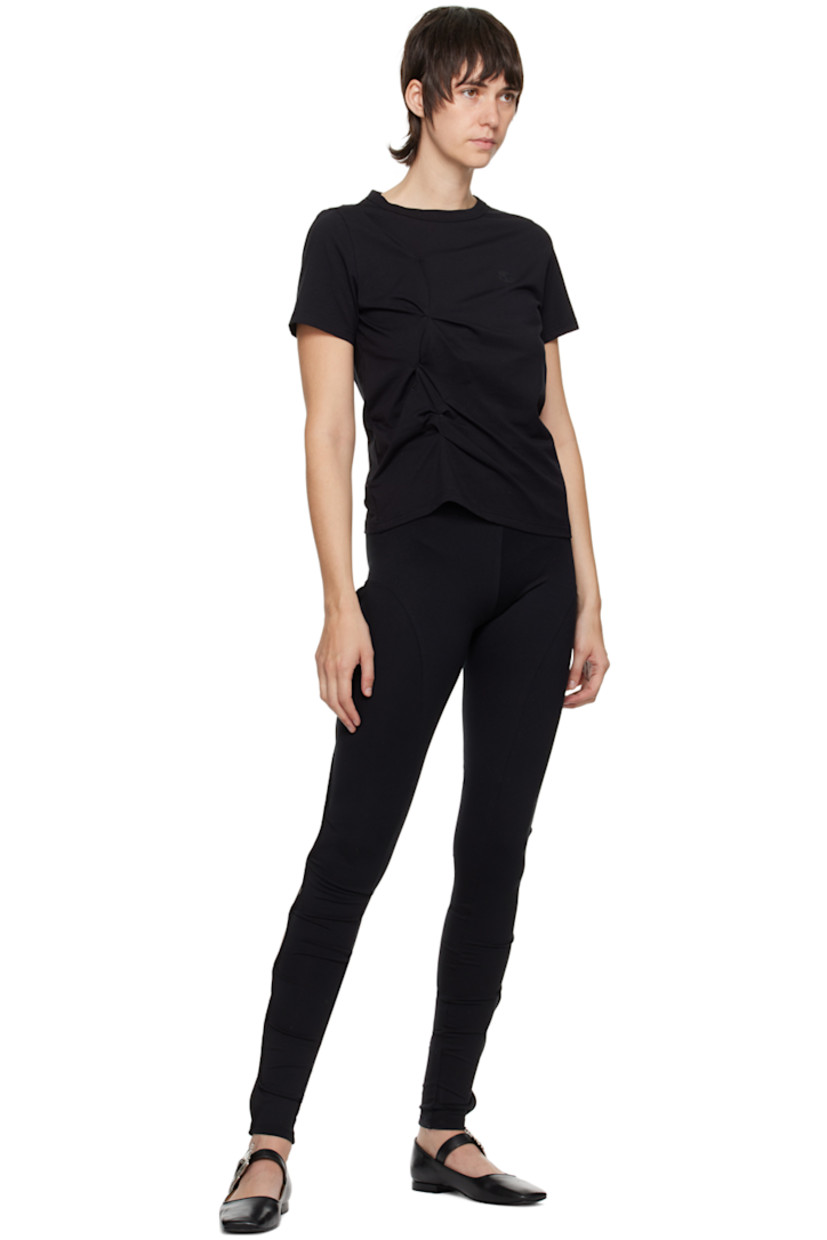 Stretch polyester jersey leggings. Vented side seams with hook-eye fastenings.

Supplier color: Black