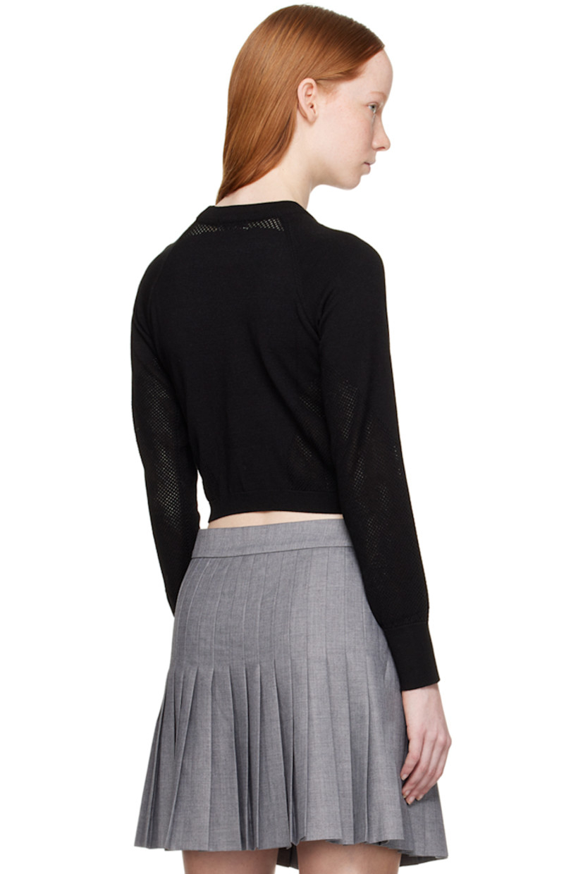 Knit rayon-blend jersey sport top. Perforated detailing throughout. 

· Rib knit crewneck, hem, and cuffs
· Raglan sleeves

Supplier color: Black