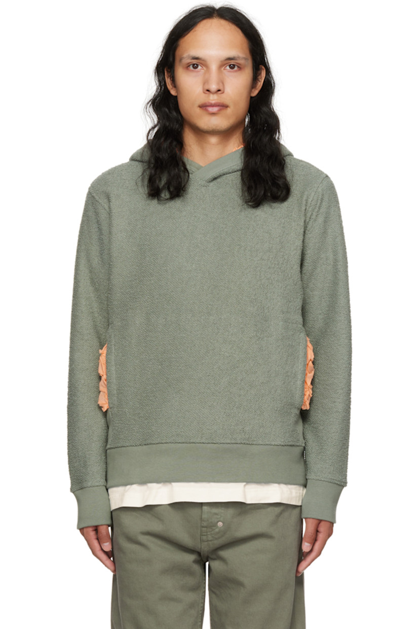 Reversed French terry hoodie.

· Ruffled trim at hood and kangaroo pocket
· Rib knit collar, side seams, cuffs, and hem

Supplier color: Green/peach