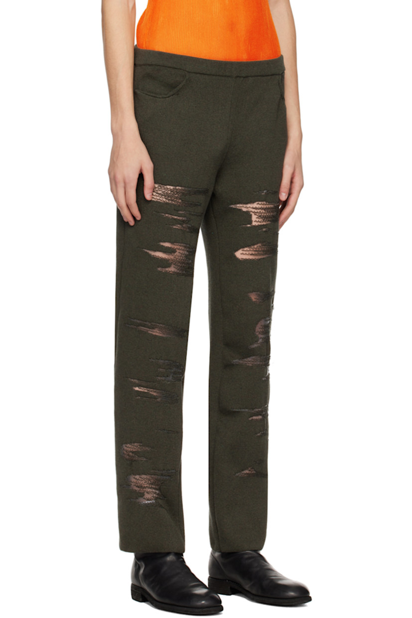 Rib knit cotton and nylon-blend trousers. Distressing and laddering throughout.

· Elasticized waistband
· Two-pocket styling

Supplier color: Dark green