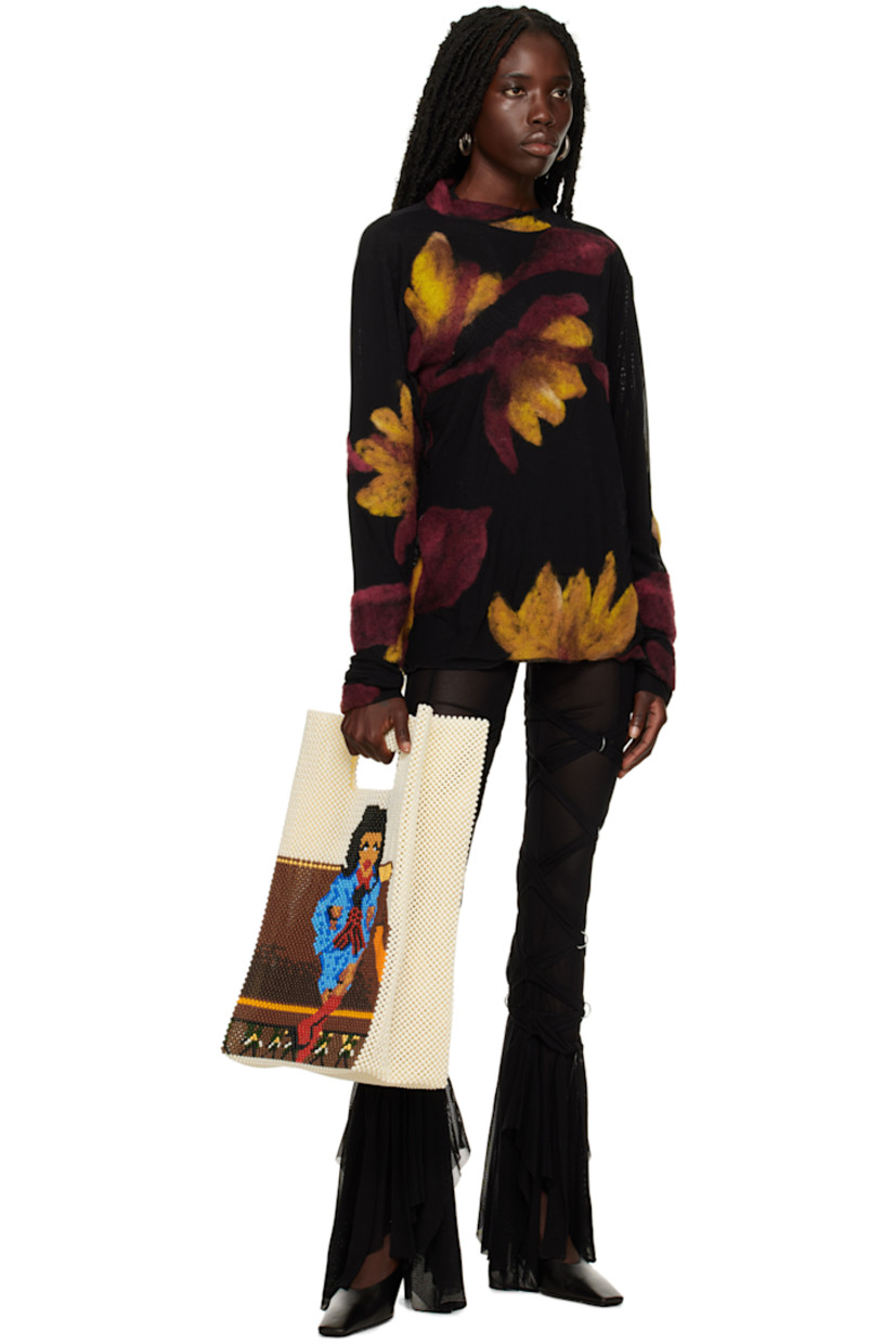 Semi-sheer polyester mesh sweater. Graphic felted appliqués throughout. 

· Crewneck 
· Full mesh lining 

Supplier color: Multi
