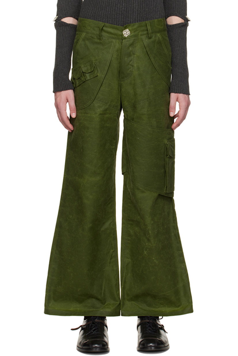 Organic cotton oilskin cargo pants.

· Layered construction
· Belt loops
· Four-pocket styling
· Button-fly
· Flap pocket at front
· Flap pocket at outseam
· Cinch fastening at back waistband
· Silver-tone hardware

Available exclusively at SSENSE.

Supplier color: Forest green