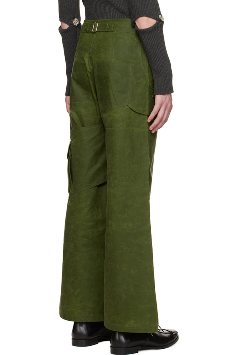 Organic cotton oilskin cargo pants.

· Layered construction
· Belt loops
· Four-pocket styling
· Button-fly
· Flap pocket at front
· Flap pocket at outseam
· Cinch fastening at back waistband
· Silver-tone hardware

Available exclusively at SSENSE.

Supplier color: Forest green