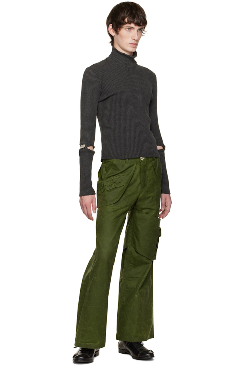 Organic cotton oilskin cargo pants.

· Layered construction
· Belt loops
· Four-pocket styling
· Button-fly
· Flap pocket at front
· Flap pocket at outseam
· Cinch fastening at back waistband
· Silver-tone hardware

Available exclusively at SSENSE.

Supplier color: Forest green