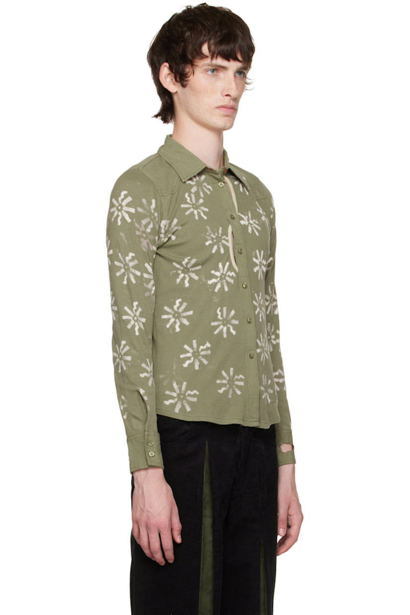 Rib knit stretch cotton shirt. Bleached floral pattern throughout.

· Cotton canvas trim at spread collar and cuffs
· Button closure
· Cutouts at front
· Shirttail hem
· Saddle shoulders
· Two-button barrel cuffs
· Mother-of-pearl hardware

Each item is unique. Please note coloration may vary.

Available exclusively at SSENSE.

Supplier color: Green/Cream