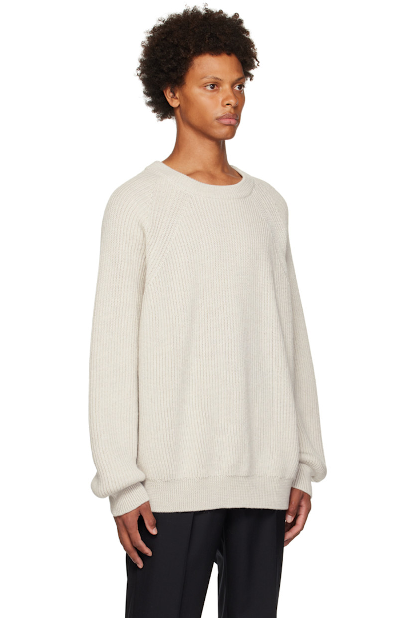 Rib knit virgin wool sweater.

· Crewneck 
· Raglan sleeves 

Supplier color: Sand