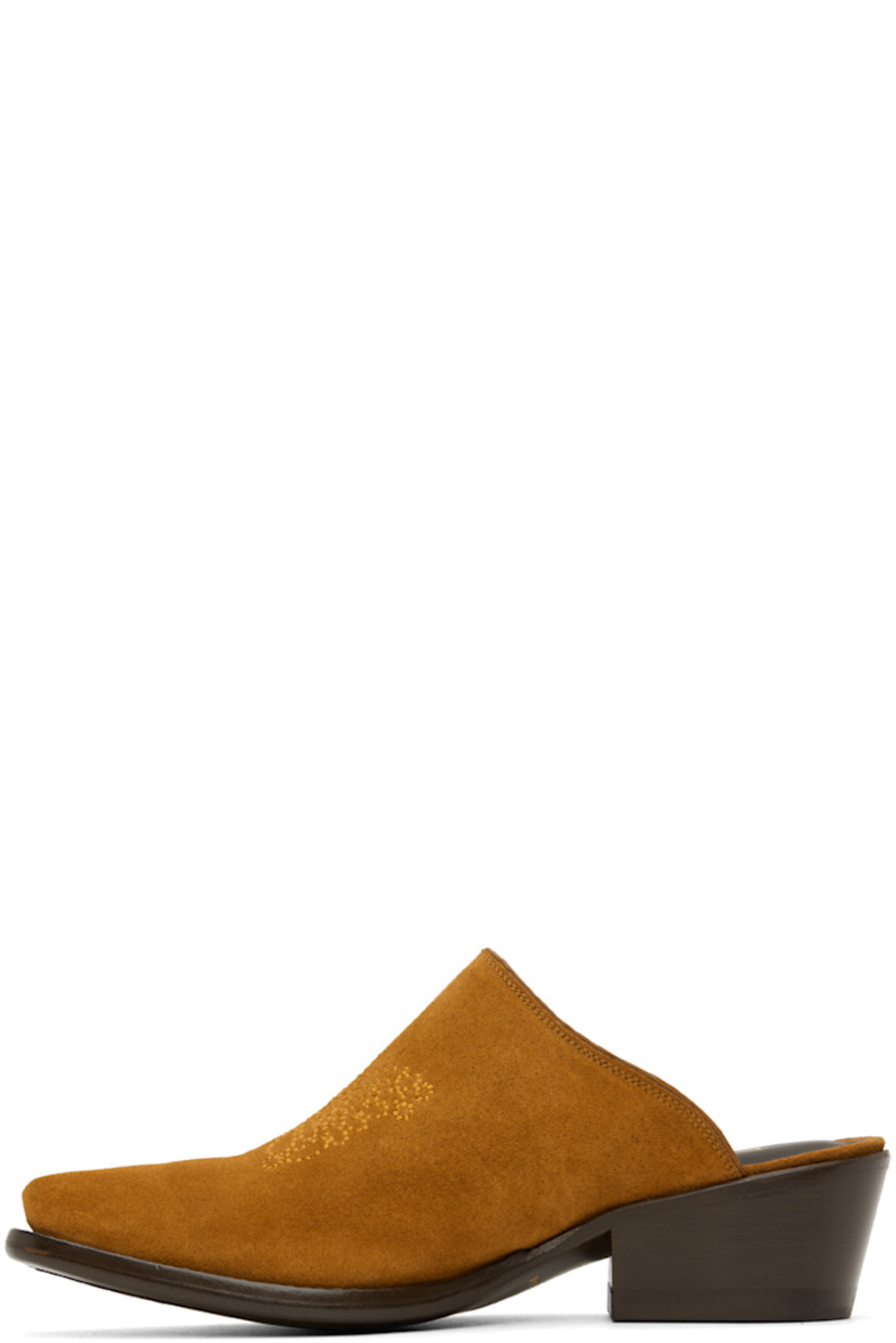 Suede mules in tan. 

· Pointed toe 
· Graphic stitched at vamp
· Gold-tone logo stamp at leather footbed 
· Buffed leather lining in brown
· Stacked leather heel with rubber injection
· Leather sole 
· Heel: H2 in 

Supplier color: Brown