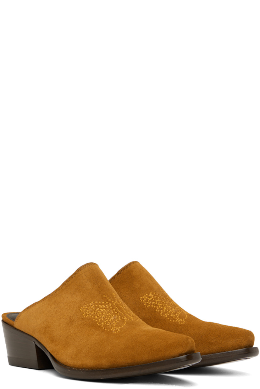 Suede mules in tan. 

· Pointed toe 
· Graphic stitched at vamp
· Gold-tone logo stamp at leather footbed 
· Buffed leather lining in brown
· Stacked leather heel with rubber injection
· Leather sole 
· Heel: H2 in 

Supplier color: Brown