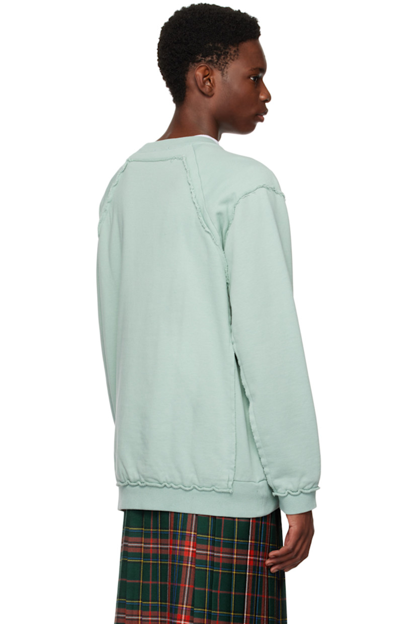 French terry sweatshirt. Raw edges throughout.

· Paneled construction
· Rib knit crewneck, hem, and cuffs
· Logo and text printed at front 
· Seam pockets

Supplier color: Peppermint