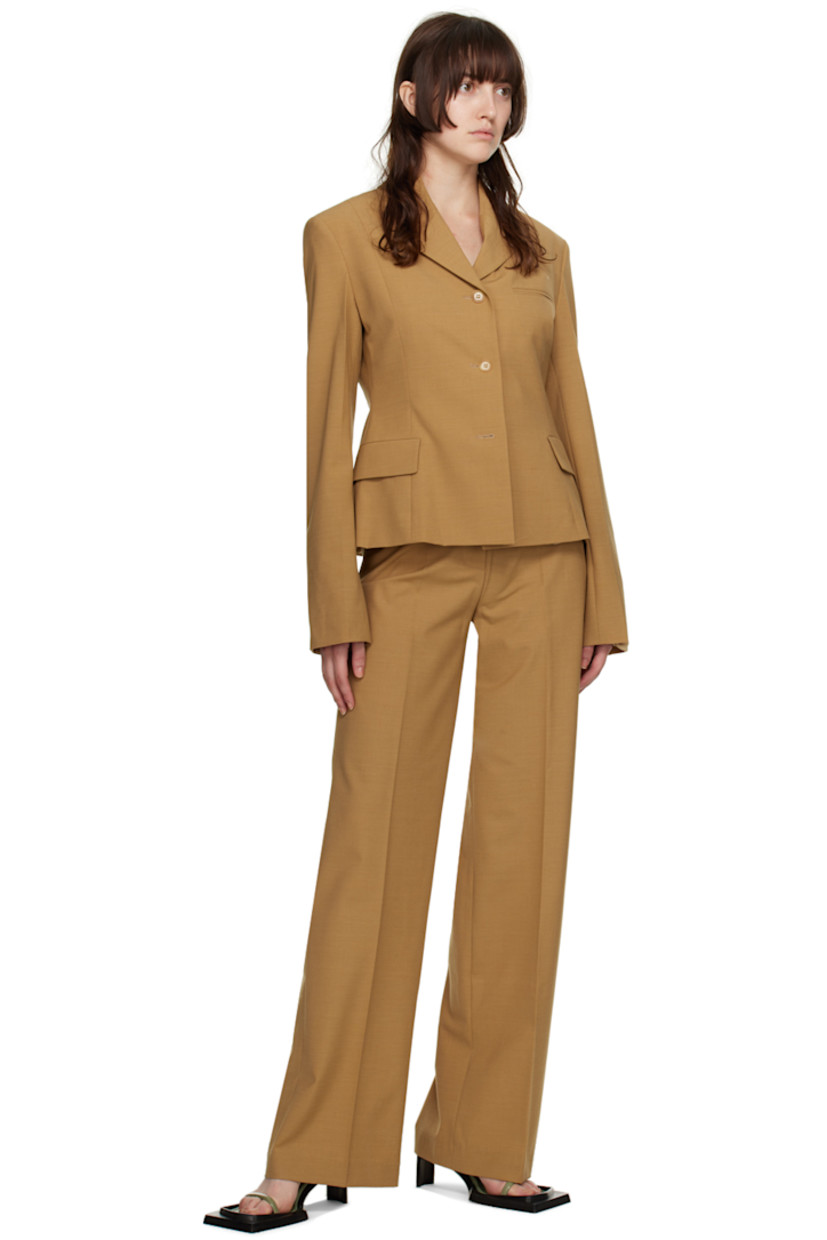 Plain-woven modal-blend blazer.

· Notched lapel
· Button closure
· Welt pocket at chest
· Flap pockets at waist
· Four-button surgeon's cuffs
· Central vent at back hem
· Full viscose satin lining

Supplier color: Camel