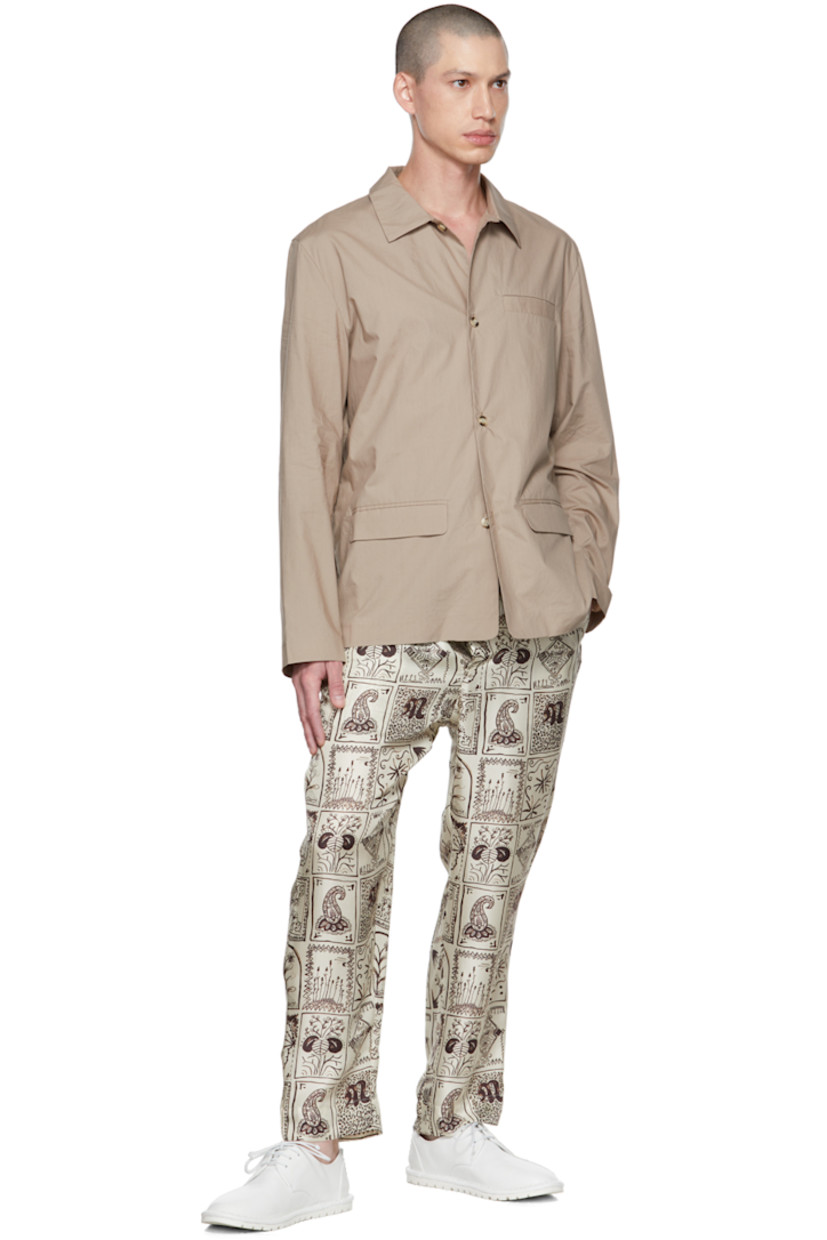 Cotton poplin shirt.

· Spread collar
· Button closure
· Welt pocket 
· Flap pockets 

Supplier color: Stone