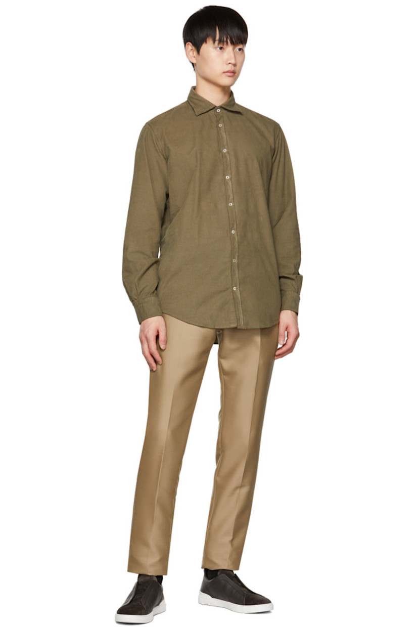 Watercolor-dyed cotton corduroy shirt. 

· Spread collar 
· Button closure 
· Logo embroidered at front
· Curved hem 
· Two-button barrel cuffs 
· Mother-of-pearl hardware 

Supplier color: Military