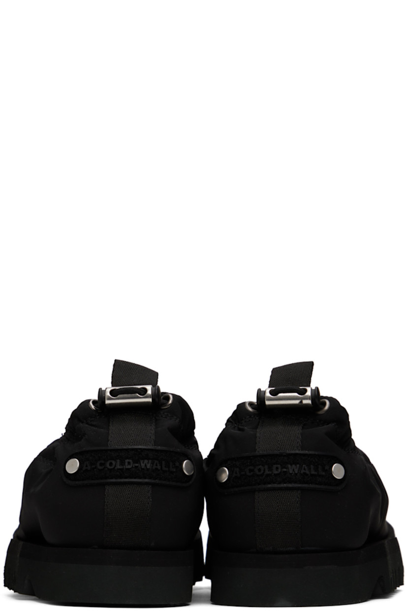Nylon twill loafers in black. Logo appliqué at heel counter.

· Pleats at vamp
· Pull-loop and cord-lock drawstring at heel collar
· Grained leather lining
· Treaded Vibram® foam rubber sole

Supplier color: Black