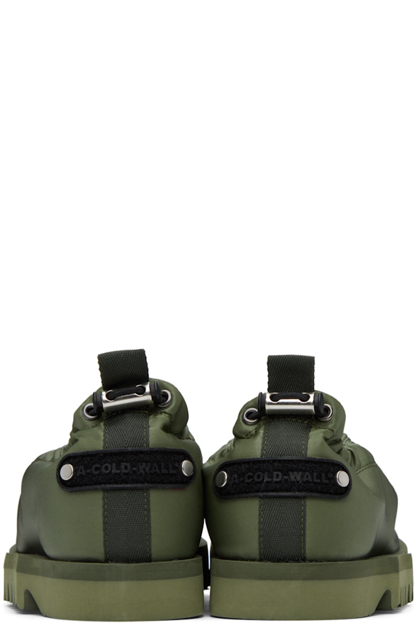 Nylon satin loafers in khaki.

· Pinched seams at vamp
· Bungee-style drawstring at elasticized collar
· Grosgrain pull-loop at heel collar
· Textile logo patch at heel tab
· Buffed calfskin lining
· Foam rubber midsole
· Treaded Vibram® rubber outsole

Supplier color: Military green