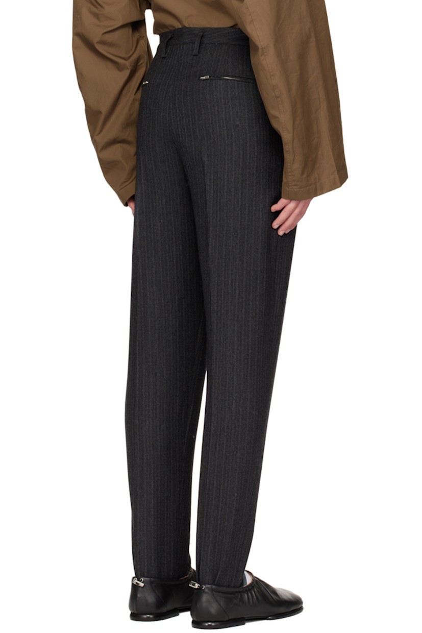 Virgin wool twill trousers. Stripes throughout.

· Belt loops
· Five-pocket styling
· Zip-fly
· Twin darts at front and back
· Central creases at front and back
· Stirrup at elasticized cuffs

Supplier color: Gray pinstripe