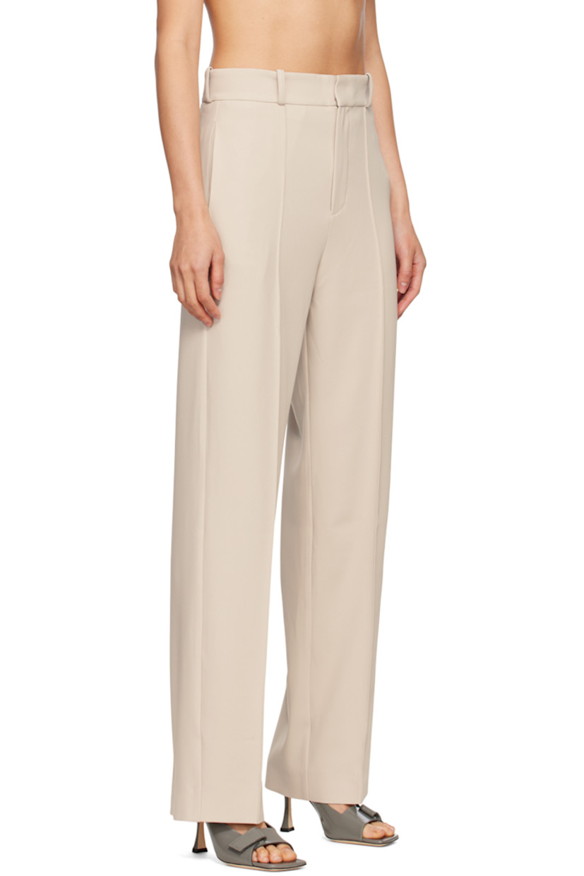 Wide-leg polyester crepe trousers.

· Belt loops
· Four-pocket styling
· Zip-fly
· Pinched seams at legs
· Darts at back waist
· Partial satin lining

Supplier color: Almond