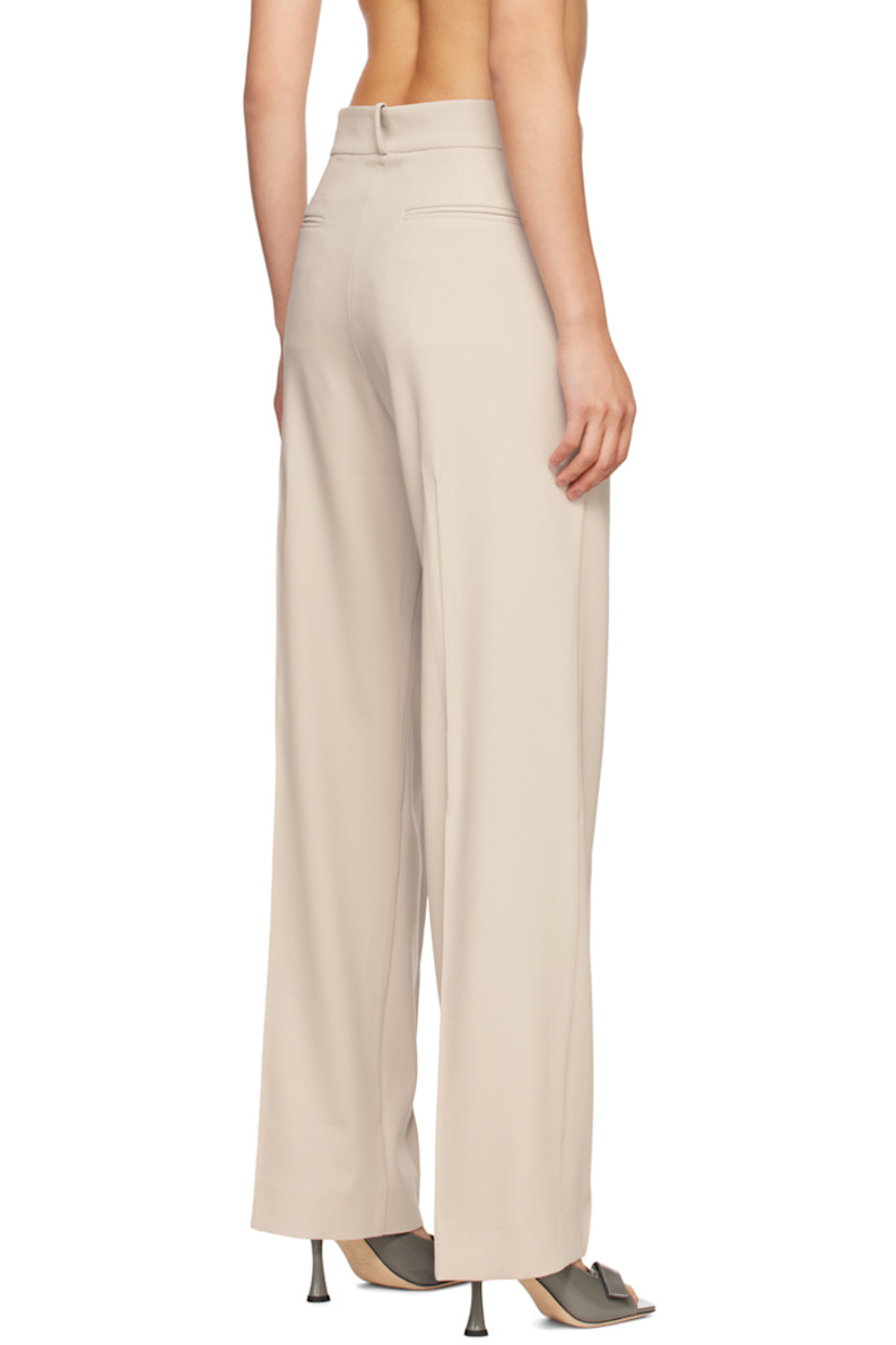 Wide-leg polyester crepe trousers.

· Belt loops
· Four-pocket styling
· Zip-fly
· Pinched seams at legs
· Darts at back waist
· Partial satin lining

Supplier color: Almond