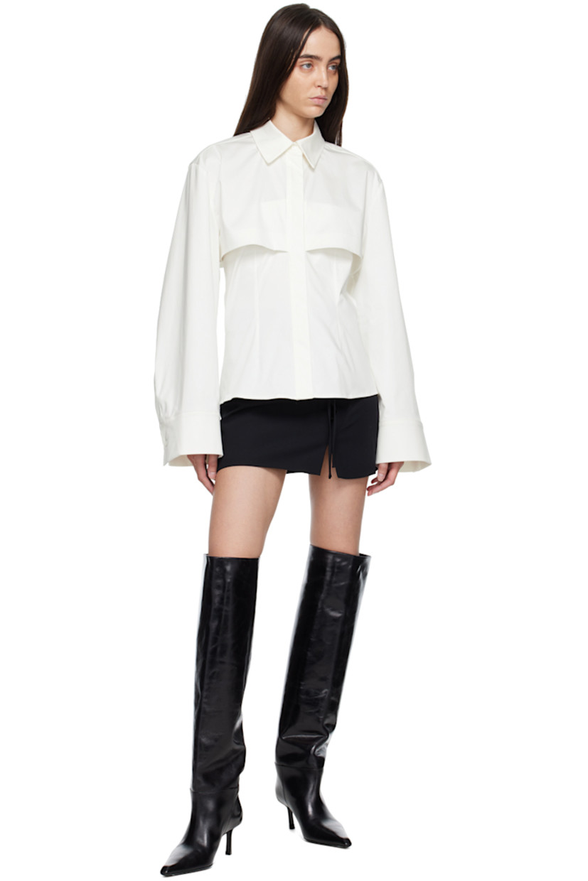 Polyester twill skirt. 

· Offset lace-up fastening at front
· Slit at front hem
· Zip closure at back
· Full satin lining

Supplier color: Black