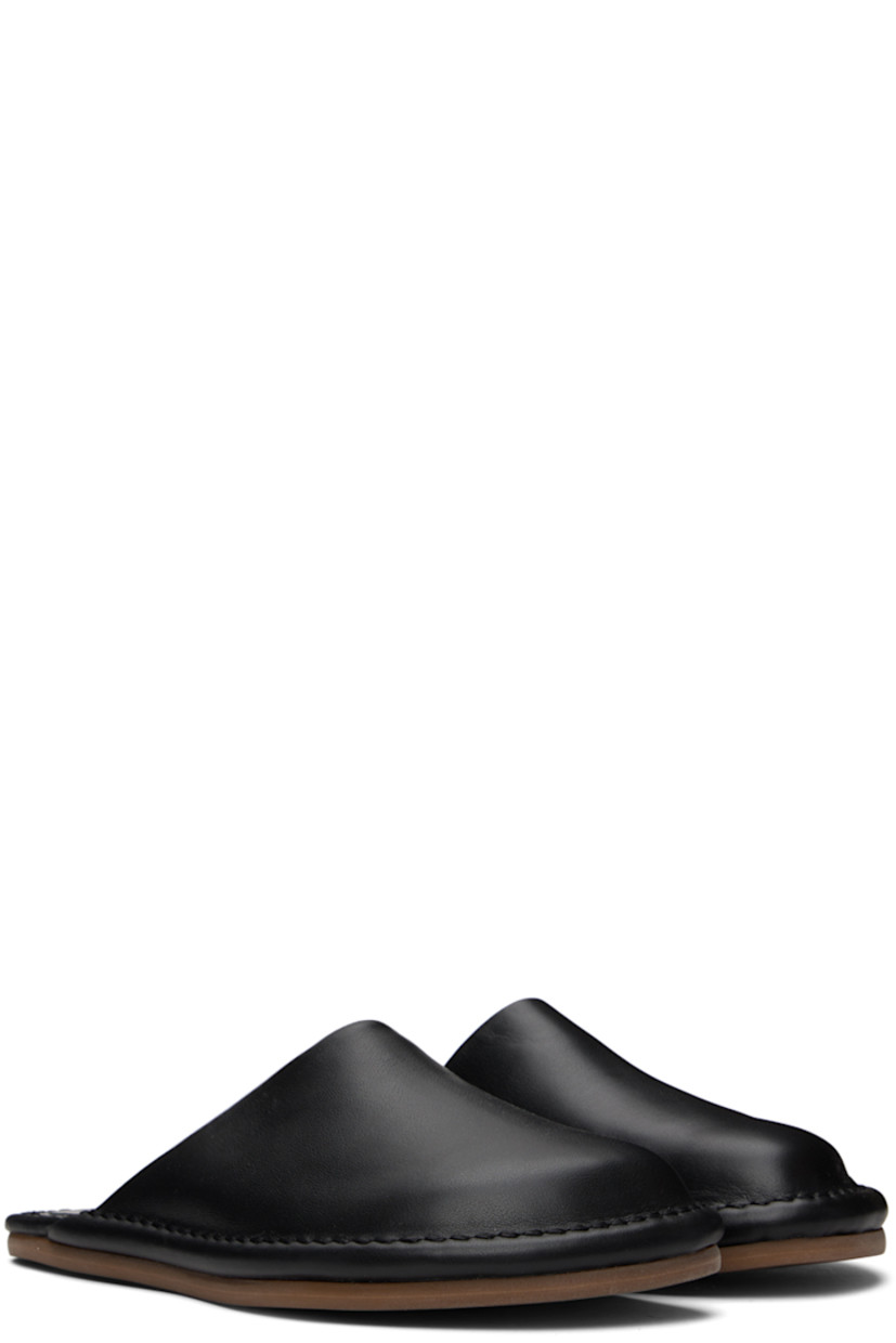 Buffed leather slippers in black.

· Leather lining
· Tonal topstitching at welt
· Rubber sole

Available exclusively at SSENSE.

Supplier color: Black
