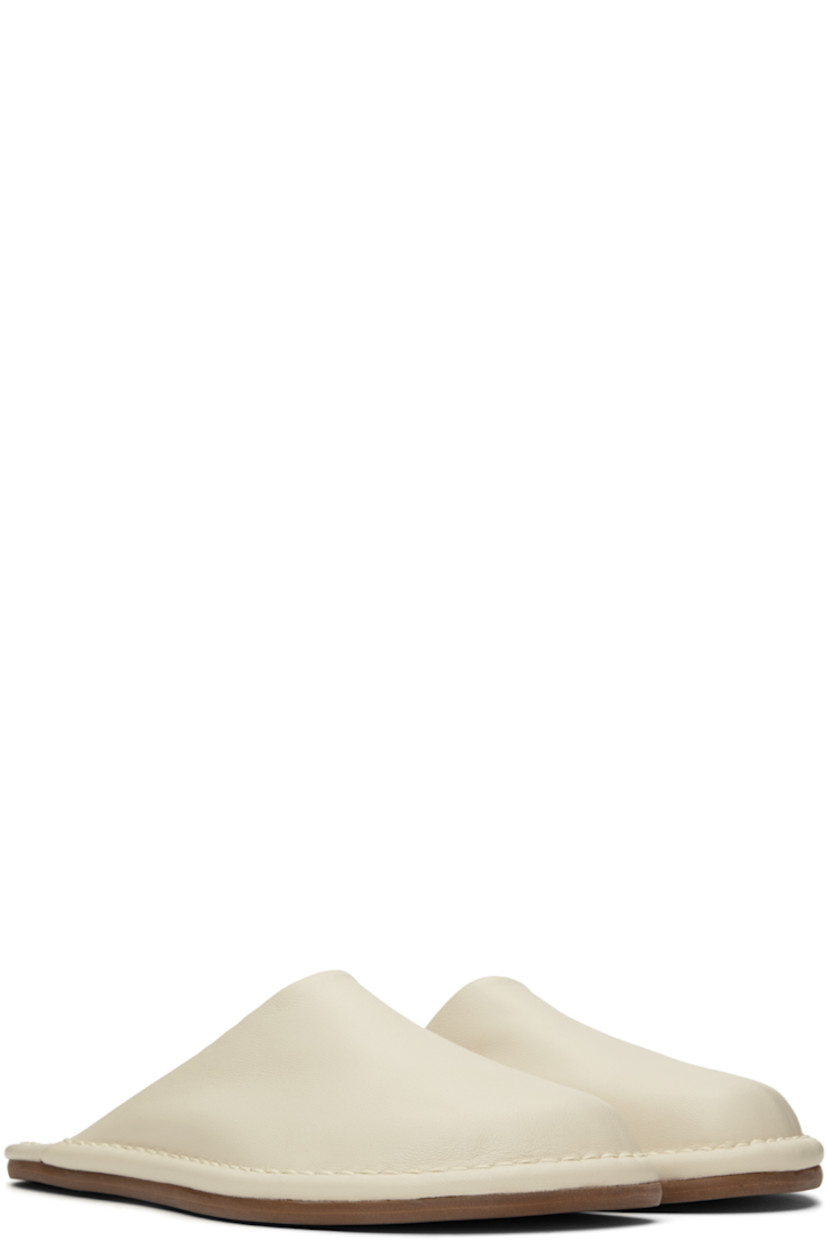 Buffed leather slippers in off-white.

· Leather lining
· Tonal topstitching at welt
· Rubber sole

Available exclusively at SSENSE.

Supplier color: Off white