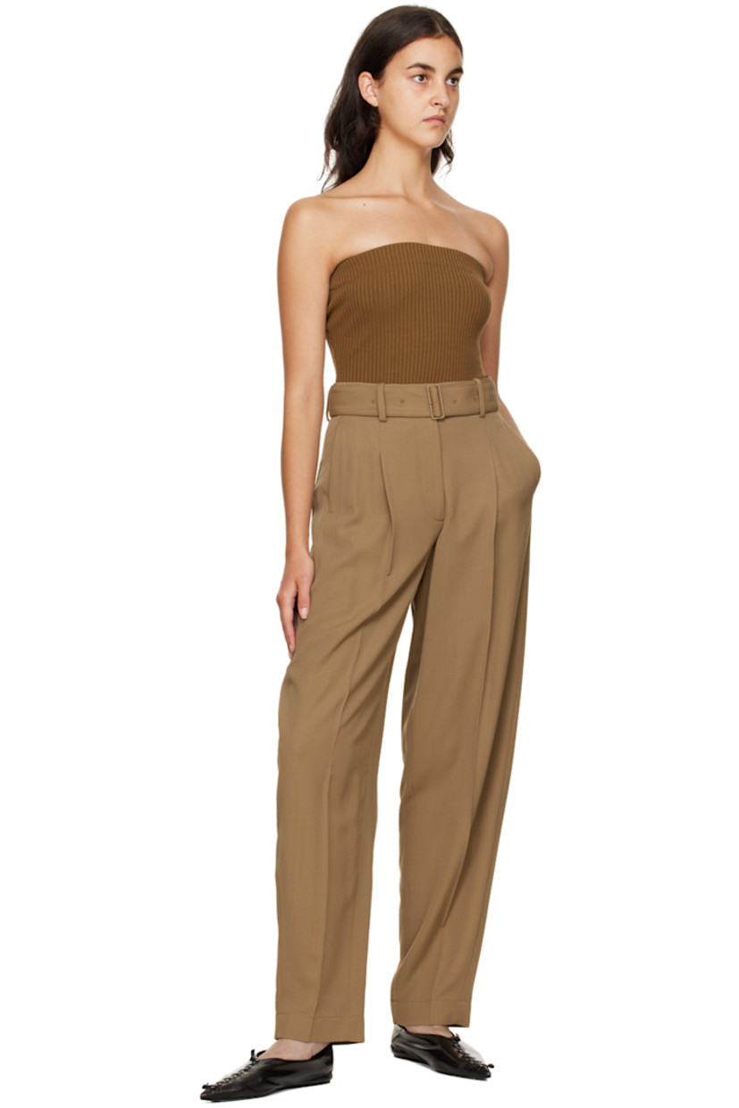 Straight-leg viscose and virgin wool-blend twill trousers.

· High-rise
· Belt loops
· Detachable pin-buckle belt
· Three-pocket styling
· Zip-fly
· Pleats at front 
· Creased legs 

Supplier color: Camel