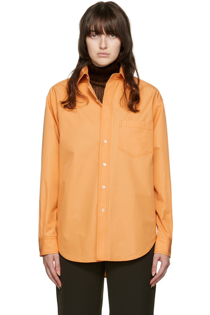 Cotton poplin shirt. 

· Spread collar
· Button closure 
· Patch pocket
· Adjustable two-button barrel cuffs
· Shirttail hem

Wholesale exclusivity at SSENSE. 

Supplier color: Tumeric