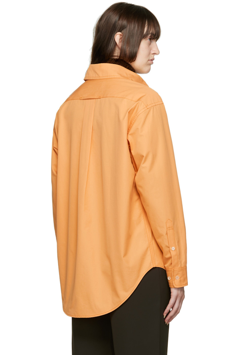 Cotton poplin shirt. 

· Spread collar
· Button closure 
· Patch pocket
· Adjustable two-button barrel cuffs
· Shirttail hem

Wholesale exclusivity at SSENSE. 

Supplier color: Tumeric