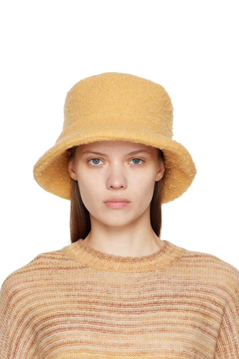 Felted wool and polyester-blend bucket hat in yellow. Unlined.

Supplier color: Yellow