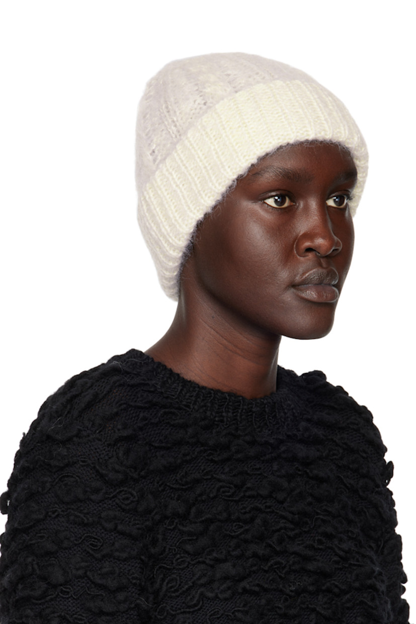 Cable knit mohair and virgin wool-blend beanie in off-white. Rib knit rolled brim.

Supplier color: White