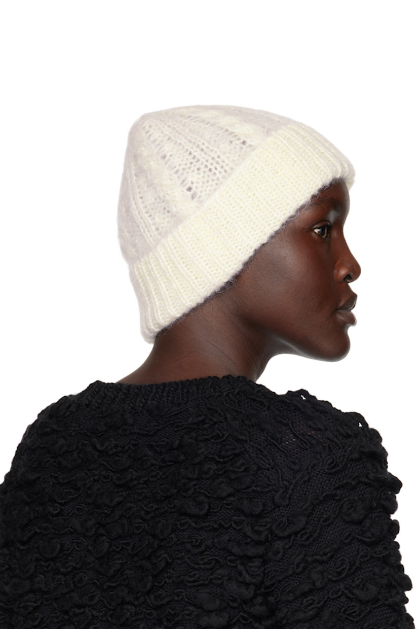Cable knit mohair and virgin wool-blend beanie in off-white. Rib knit rolled brim.

Supplier color: White