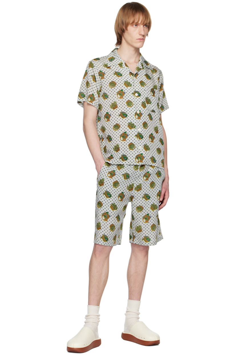 Plain-woven rexcell shirt. Polka dot and graphic pattern printed throughout. 

· Open spread collar 
· Button closure 
· Patch pocket 
· Twin pleats at back yoke

Supplier color: Baskets/Gray