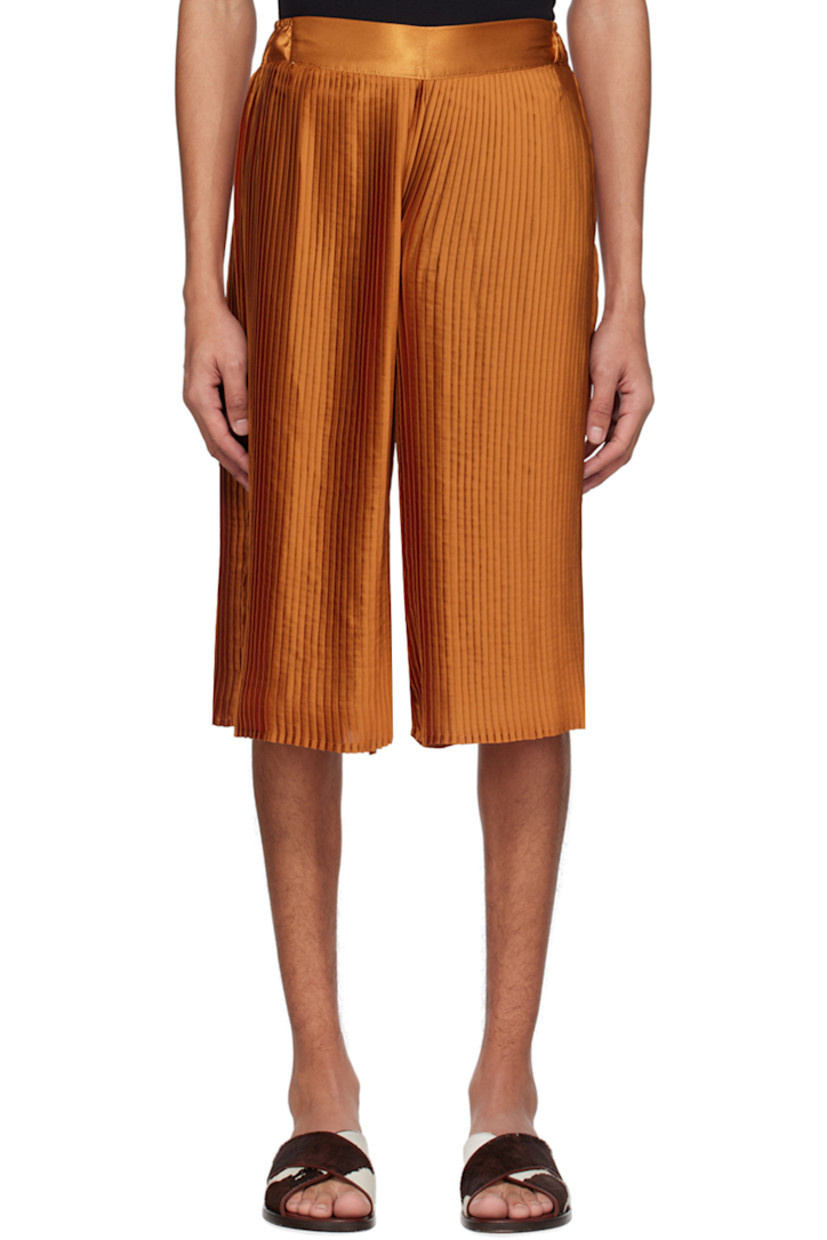 Garment-pleated polyester satin shorts. Partially elasticized waistband.

Supplier color: Orange