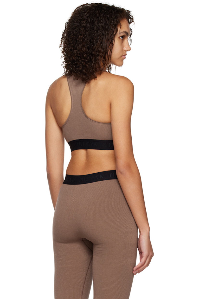 Rib knit stretch bamboo viscose-blend tank top. 

· Crewneck
· Jacquard logo at elasticized hem
· Racer back

Supplier color: Hazel