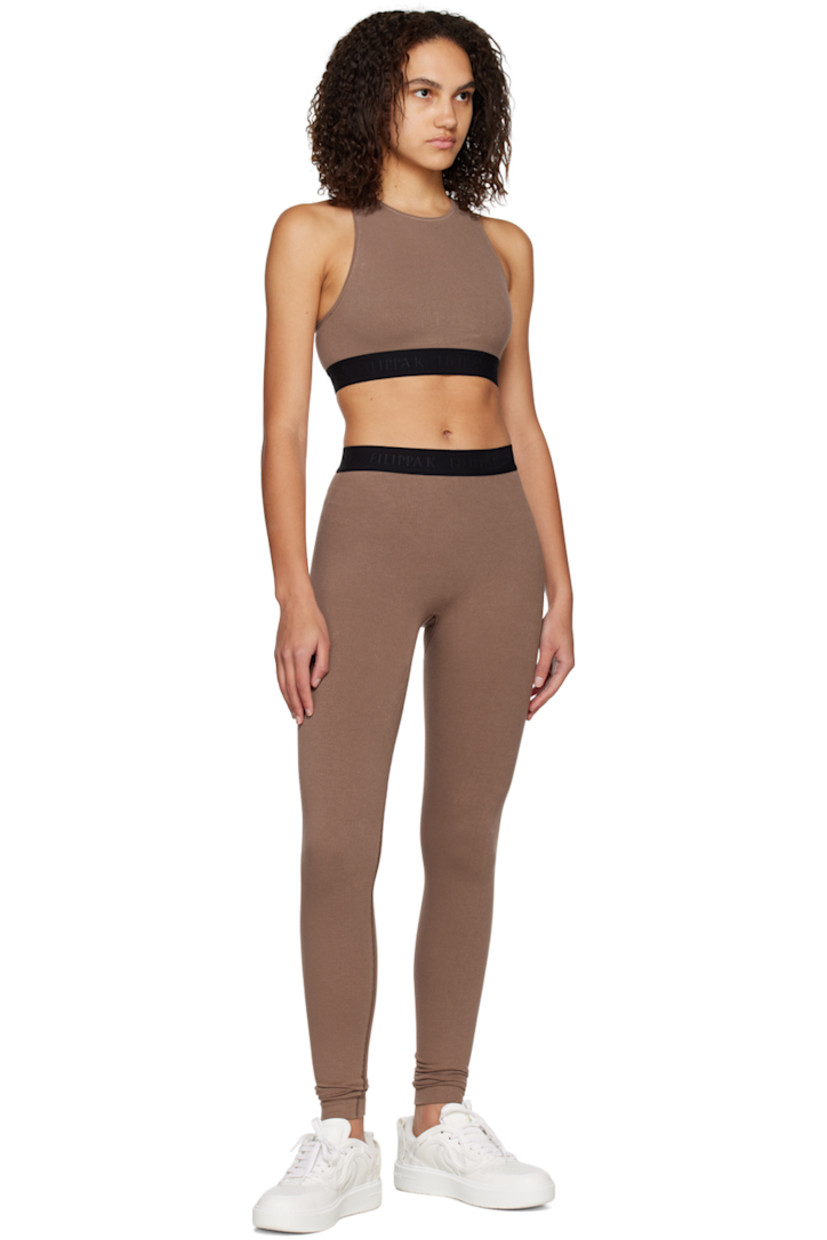 Rib knit stretch bamboo viscose-blend tank top. 

· Crewneck
· Jacquard logo at elasticized hem
· Racer back

Supplier color: Hazel