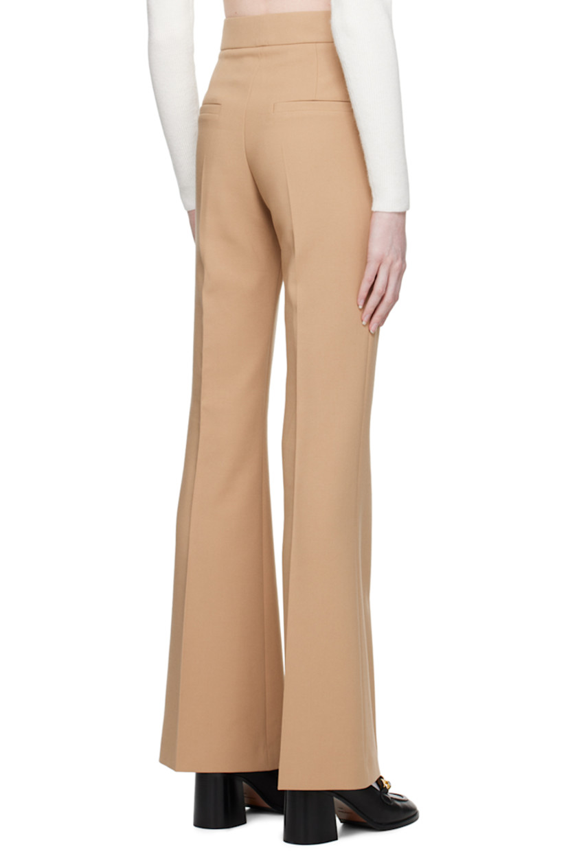 Flared plain-woven stretch polyester-blend trousers. 

· Four-pocket styling
· Zip-fly
· Central crease at legs 

Supplier color: Light/Pastel brown