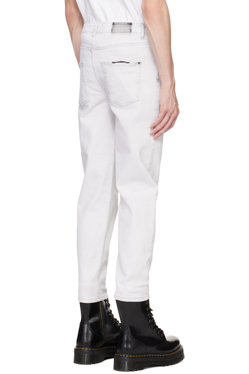Tapered wide-leg stretch denim jeans. Fading throughout.

· Belt loops
· Five-pocket styling
· Button-fly
· Embroidered logo graphic at back waistband
· Logo-engraved antiqued silver-tone hardware

Supplier color: White