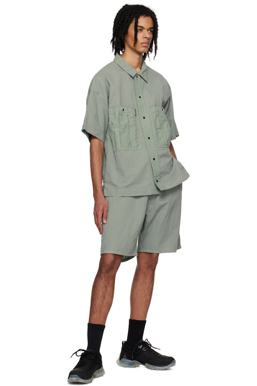 Crinkled cotton and nylon-blend canvas shorts. 

· Belt loops
· Three-pocket styling
· Zip-fly 
· Logo flag at back pocket 

Supplier color: Green milieu