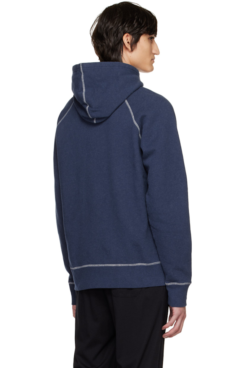 Cotton fleece hoodie. 

· Drawstring at hood
· Raglan sleeves 
· Contrast stitch at white

Supplier color: Navy melange