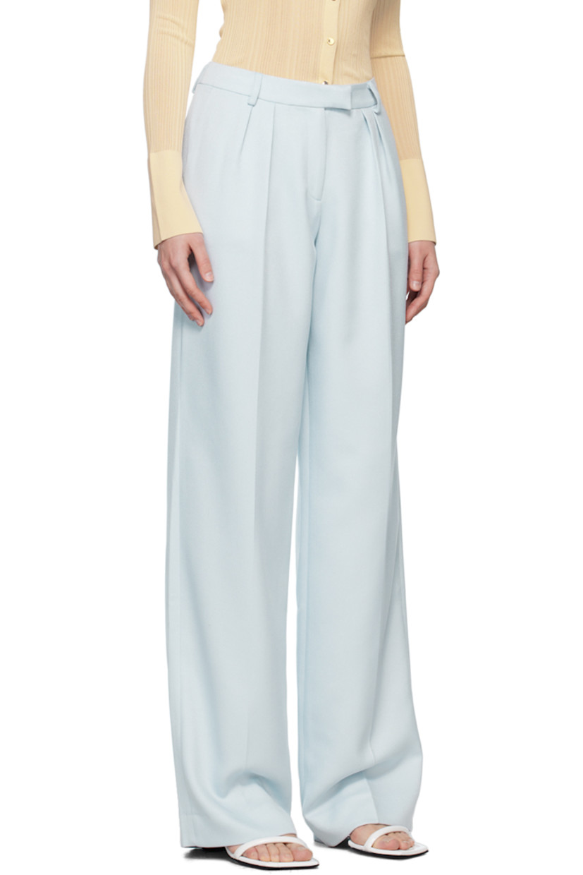 Polyester twill trousers. 

· Belt loops
· Three-pocket styling
· Zip-fly
· Pleats at front
· Creased legs

Supplier color: Sky melt