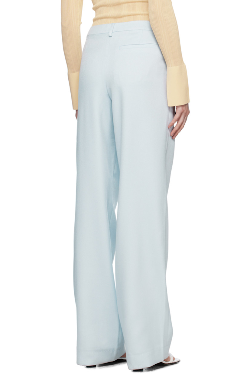 Polyester twill trousers. 

· Belt loops
· Three-pocket styling
· Zip-fly
· Pleats at front
· Creased legs

Supplier color: Sky melt