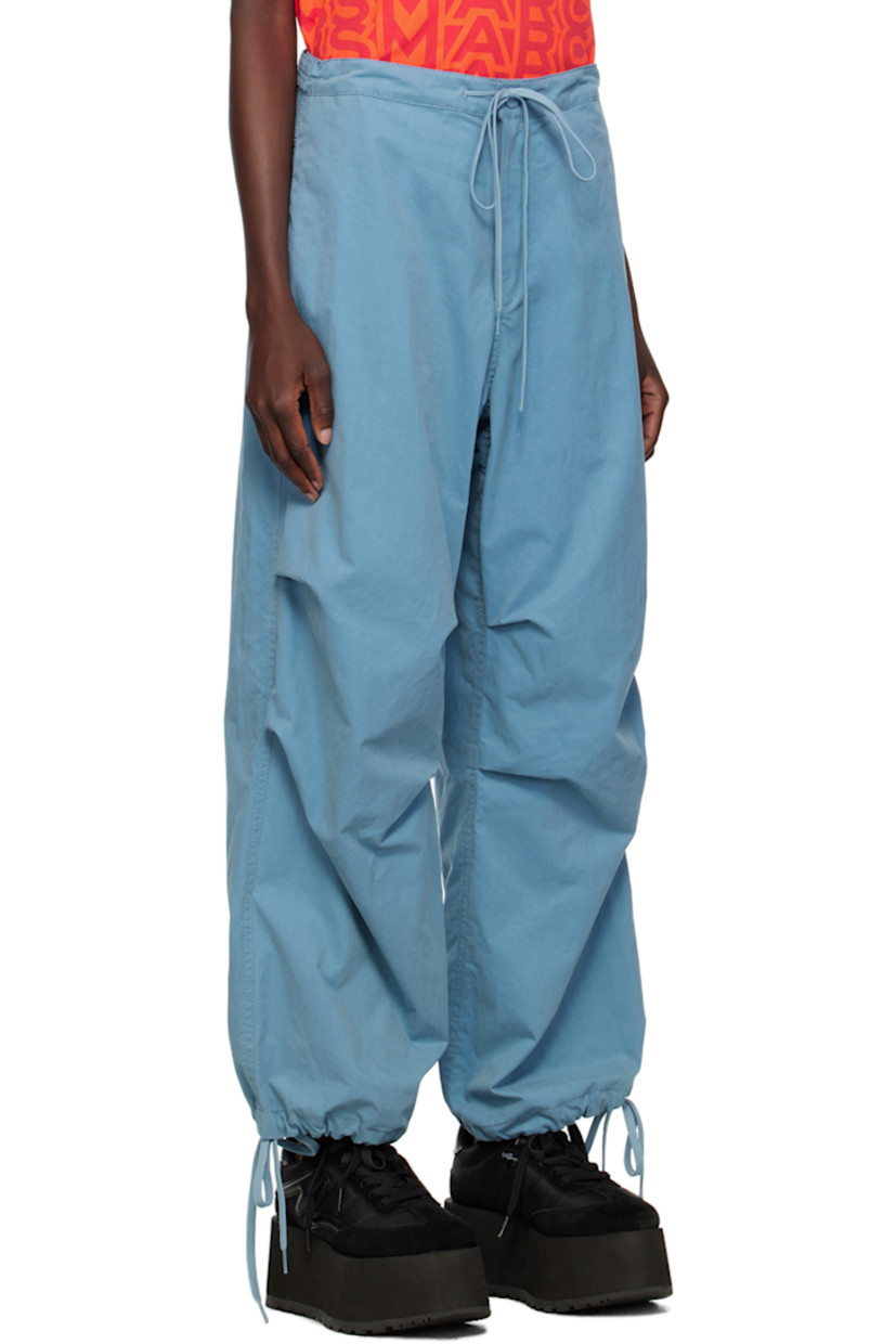 Cotton- and nylon-blend canvas trousers. 

· Drawstring at elasticized waistband
· Four-pocket styling
· Zip-fly
· Gathering at knees
· Drawstring at elasticized cuffs
· Adjustable press-stud tabs at back waistband

Supplier color: Blue shadow