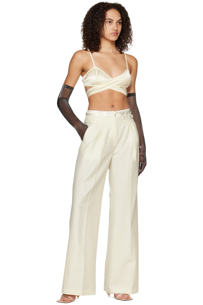 Crinkled acetate satin bralette. Cutout and elasticized scalloped trim throughout. 

· Wrap construction
· Adjustable spaghetti shoulder straps
· Hook-eye fastening at back

Supplier color: Ivory