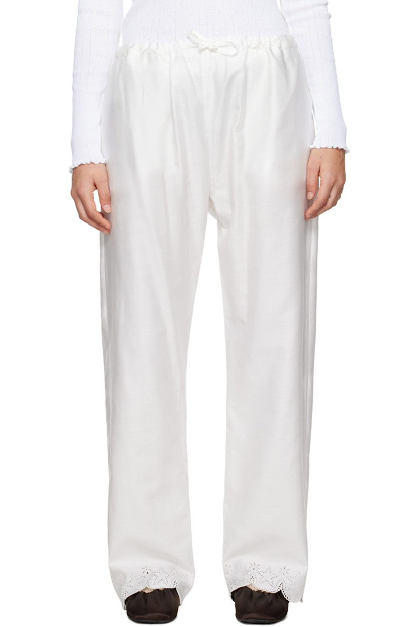 Cotton poplin lounge pants.

· Drawstring at waistband 
· Two-pocket styling
· Scalloped broderie anglaise trim at cuffs

Supplier color: White