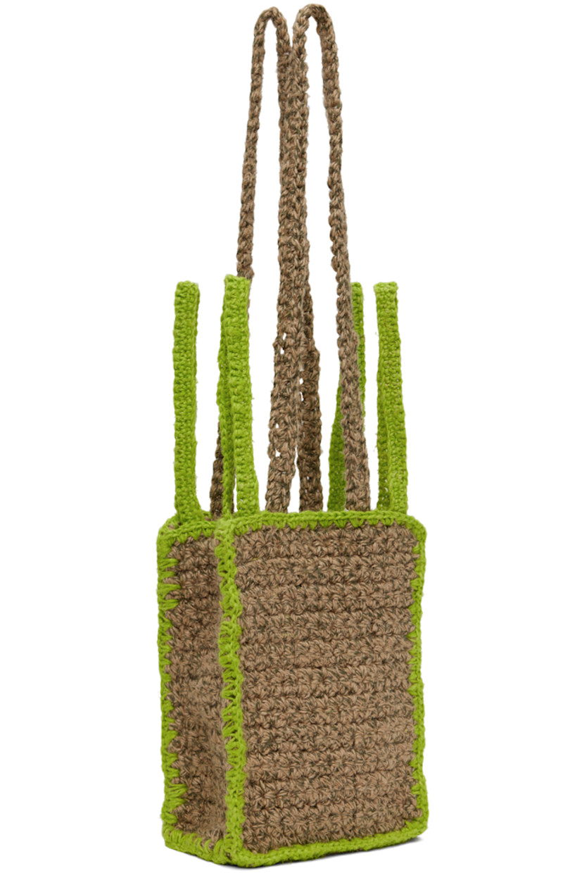 Crocheted jute- and linen-blend shoulder bag in beige and green. Blanket stitching throughout. 

· Fixed shoulder straps
· Four carry handles
· Magnetic press-stud closure
· Patch pocket at interior
· Unlined
· H9 x W6.5 x D3.5 in

Available exclusively at SSENSE.

Supplier color: Sand/Lime